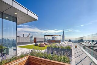 The Eugene rooftop deck with planters and greenspace