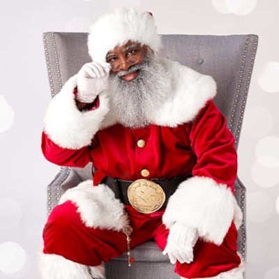 Black santa in chair