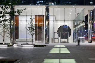 Entrance to glass office building at night