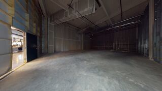 Dark empty warehouse space