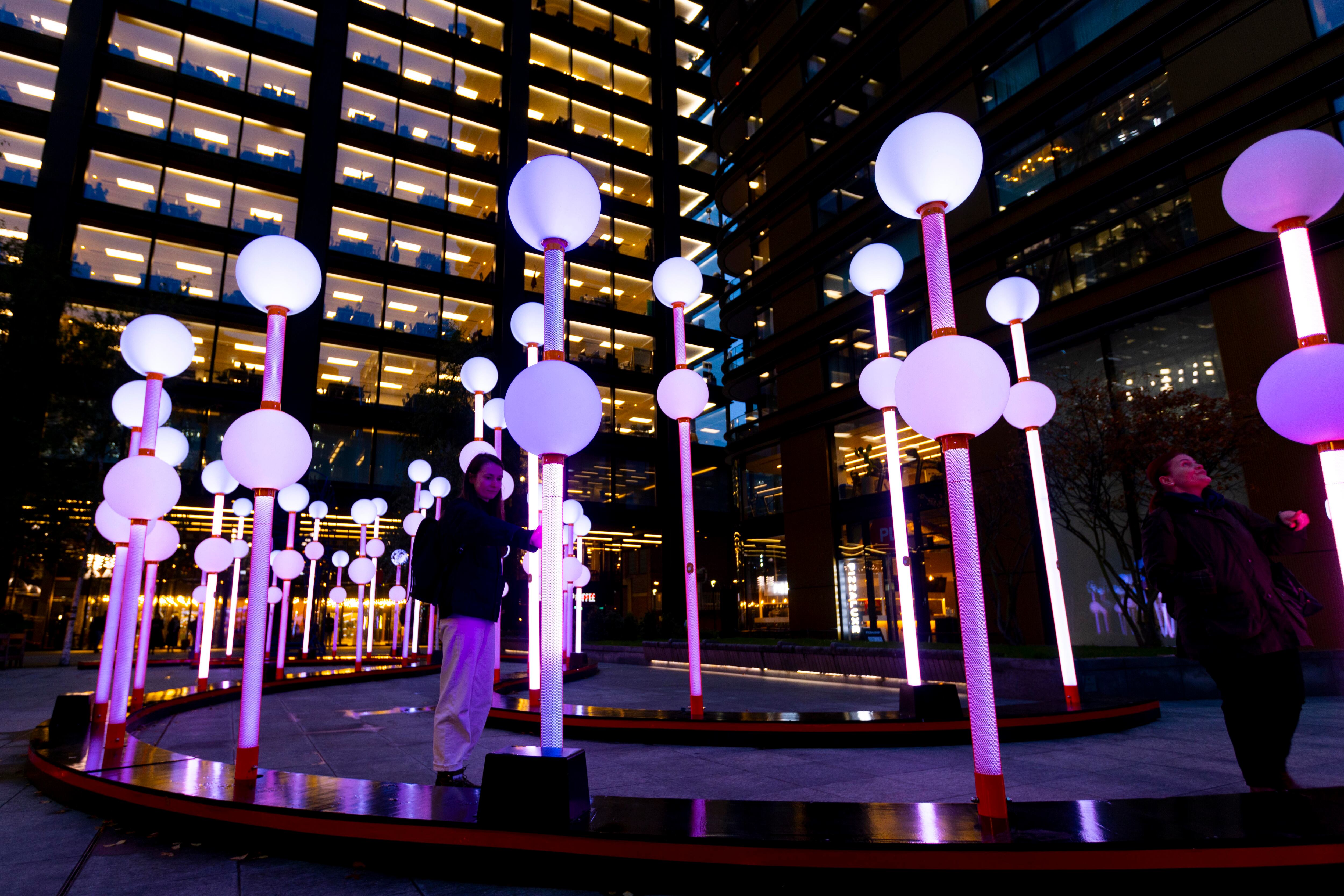 Light art display at night located in office plaza