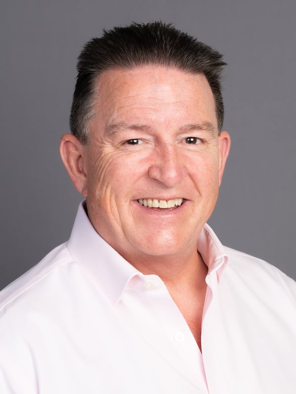 Male in light pink shirt