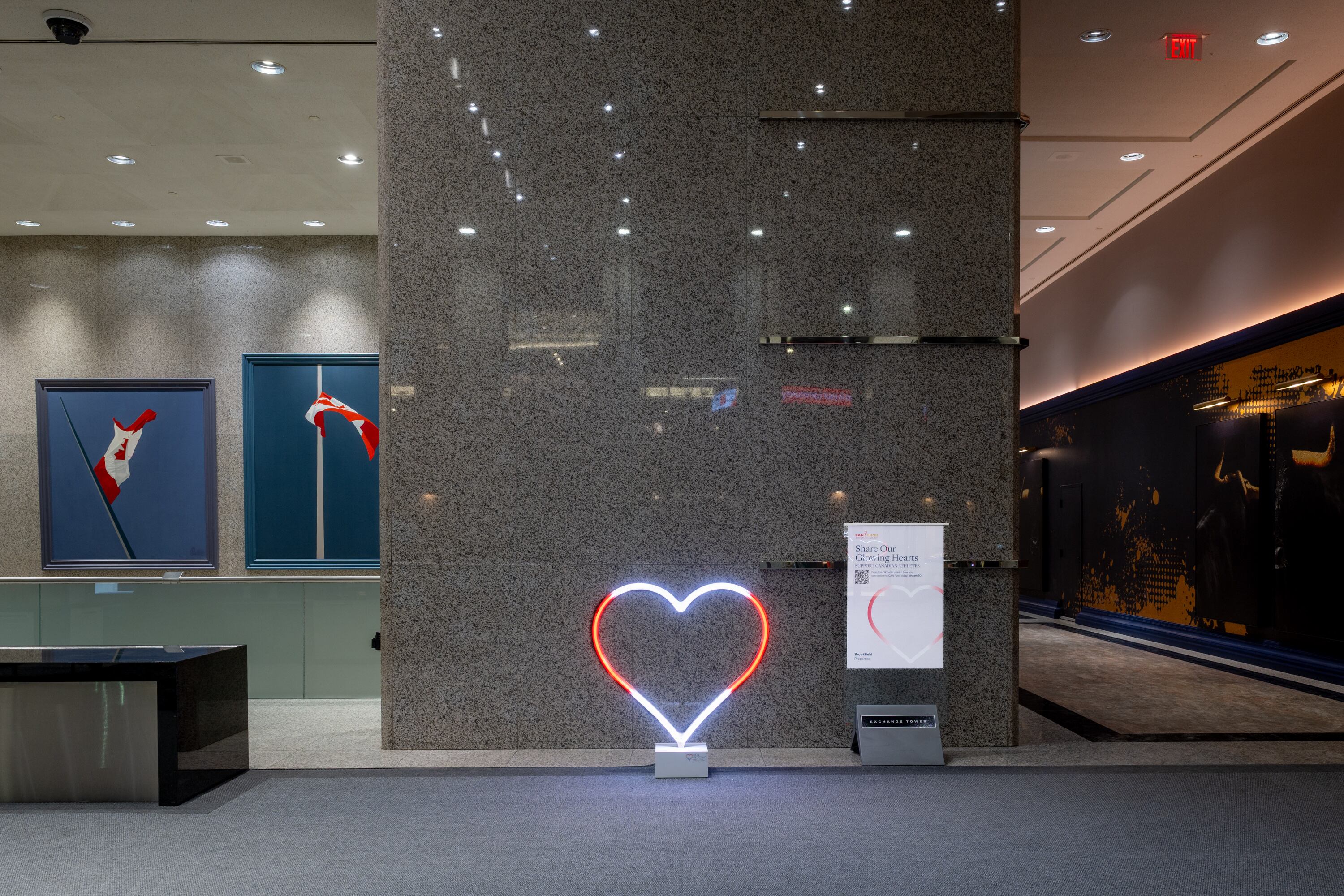 Our Glowing Hearts, 6 foot LED hearts programmed to glow red and white like a Canadian flag in the lobby of office tower.