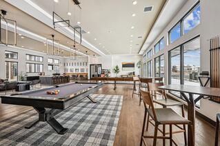 large space with pool table and seating