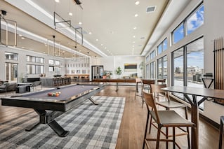 large space with pool table and seating