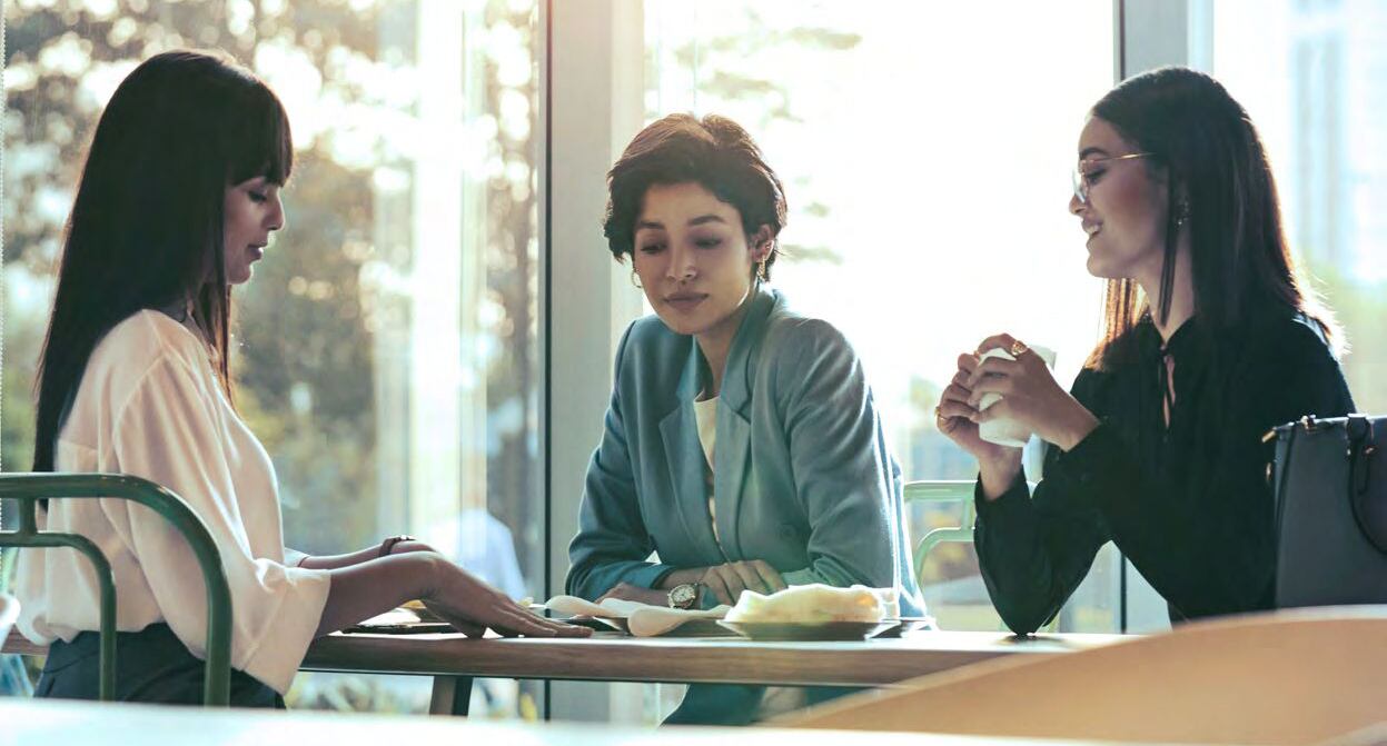 Three women in conference room