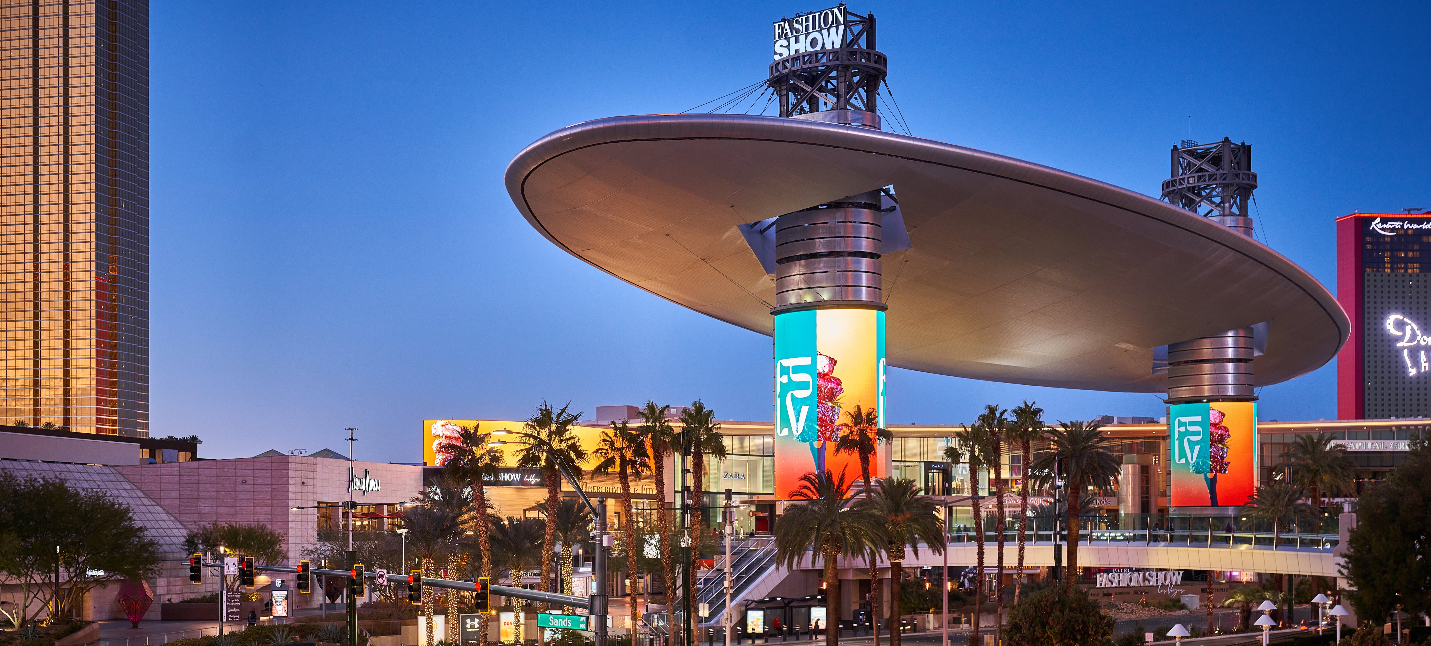 Exterior of Fashion Show Las Vegas property at dusk with large digital displays