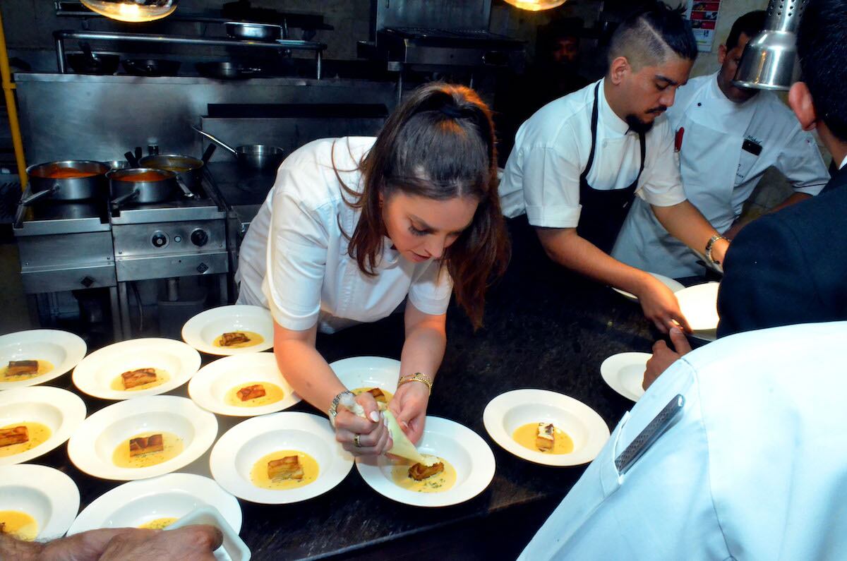 chef preparing dishes in kitchen