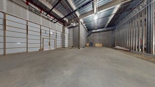 Lit empty warehouse space