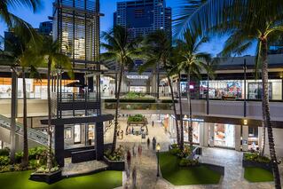 Ala Moana Center outdoor mall area with palm trees and store fronts