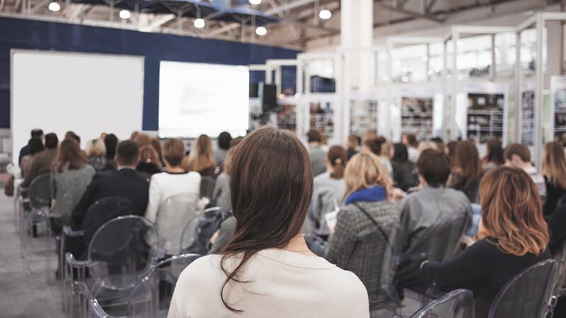 group of people listening to presentation