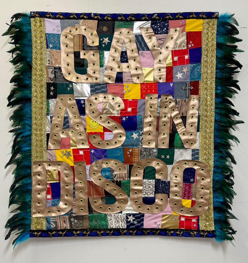 Colorful quilt that says gay as in disco