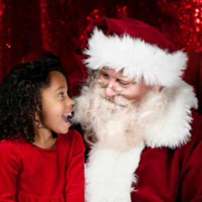 Child sitting on Santa's lap