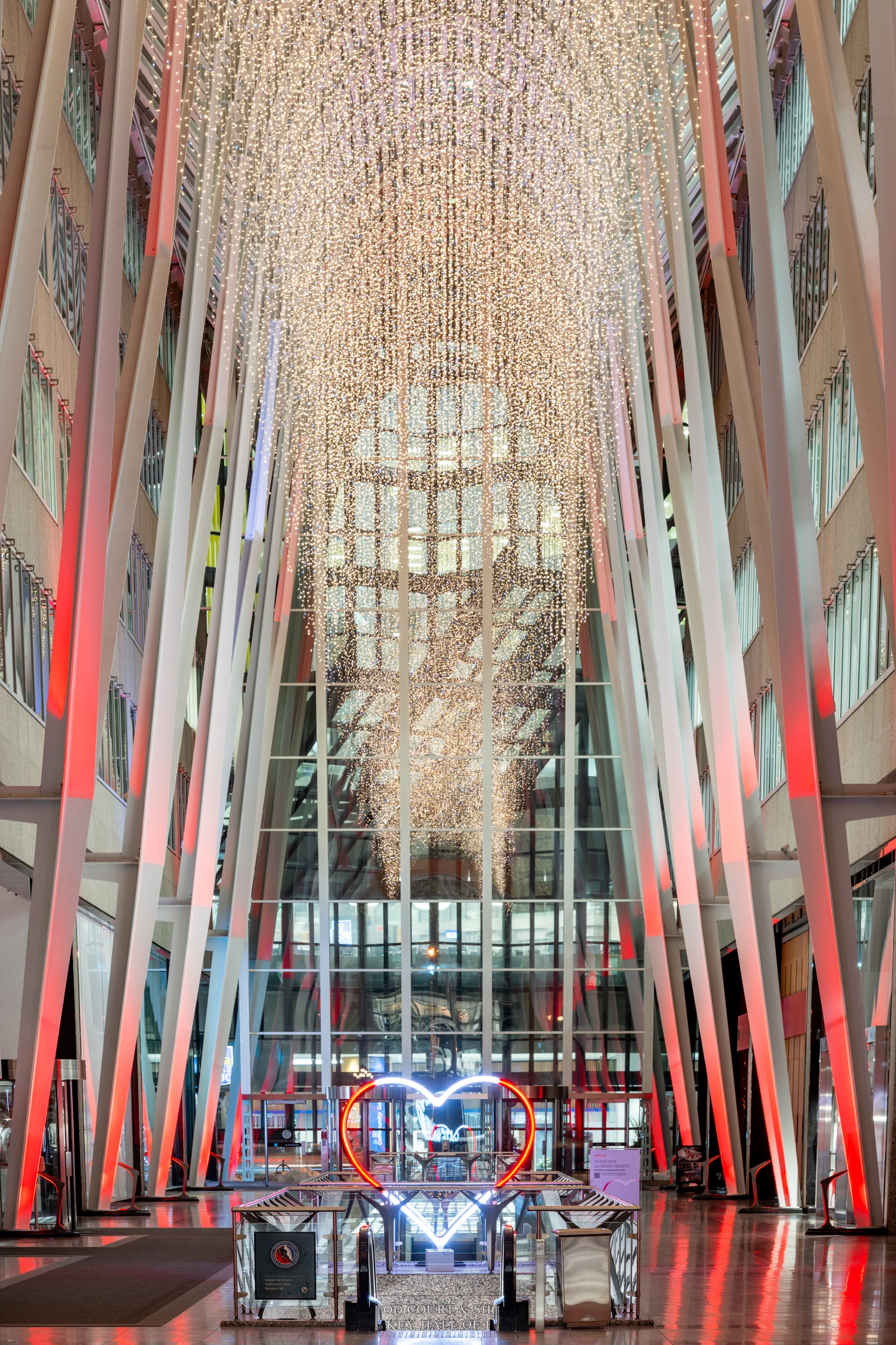 Our Glowing Hearts, 6 foot LED hearts programmed to glow red and white like a Canadian flag in the lobby of office tower.