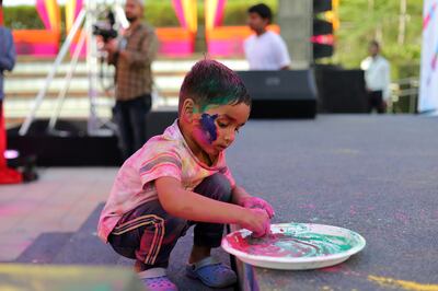 small boy with plate of colors