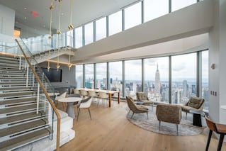 One Manhattan West tenant space with stairwell, tables and chairs