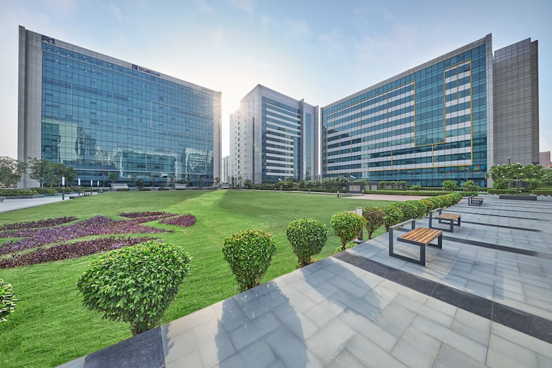 photos of a large office building with greenery in front