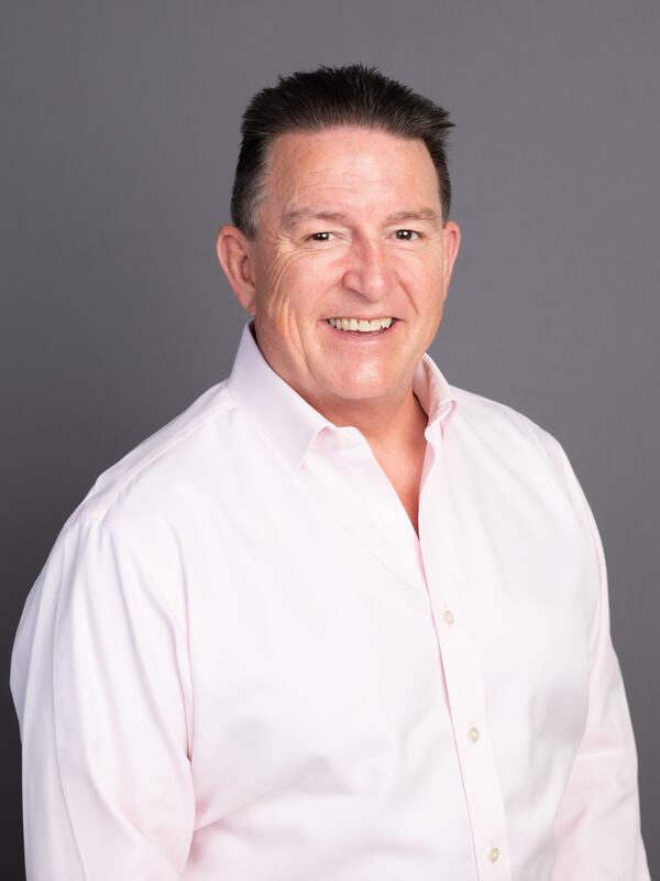 Male in light pink shirt