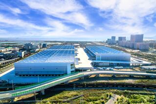 large logistics center with elevated road running in front