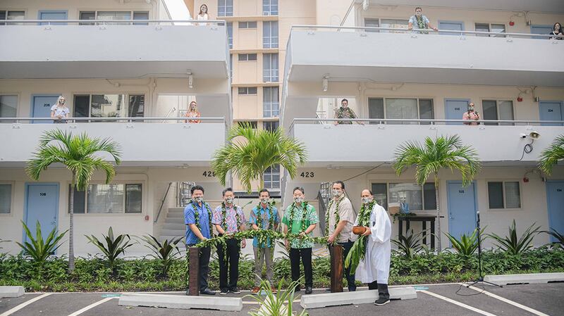 people with plants outside Lilia Waikiki building
