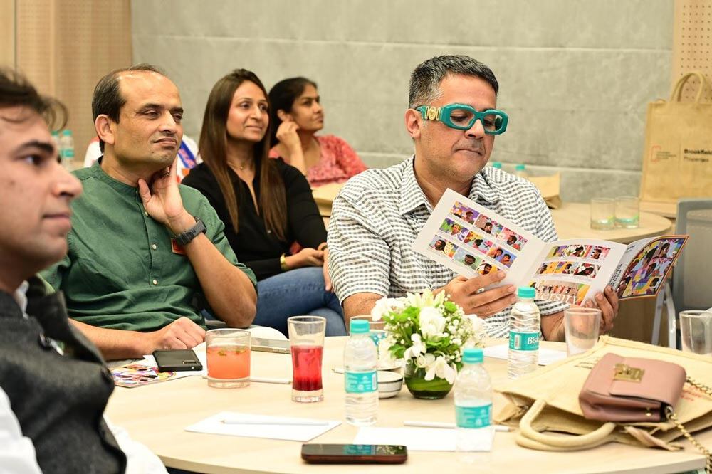 People seated at several tables attending a meeting
