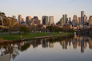 city skyline with body of water