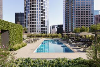 View of pool with buildings in background