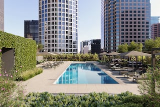 View of pool with buildings in background