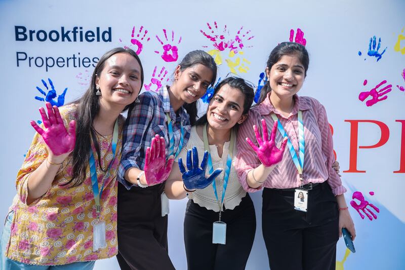group of women with colors on their hands