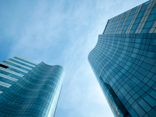 upshot of two glass office buildings in India